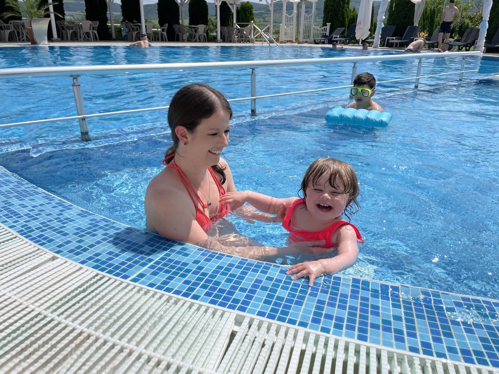 Emily and Rachel playing in the local pool.